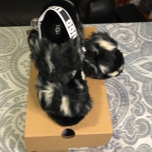Brand new UGGs slide on with the white and black spots size 8